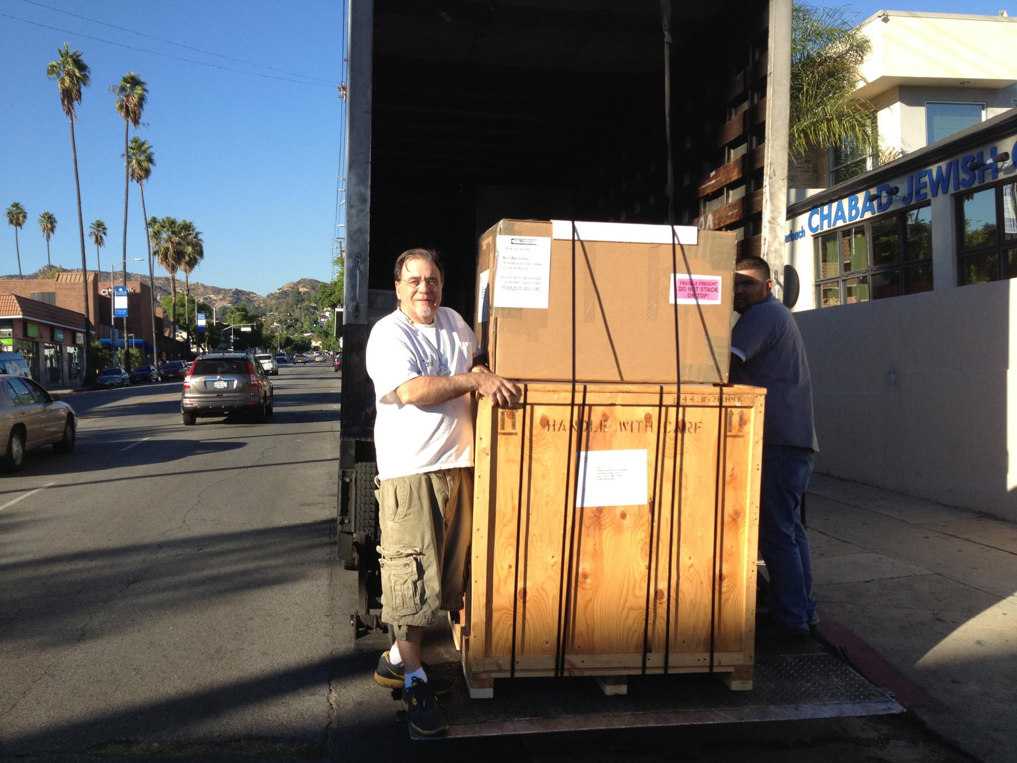 <a href="/image/image-galleries/shipping-frederic-remington-bronze/putting-crated-remington-bronze-on-liftgate">Putting Crated Remington Bronze on the liftgate</a>